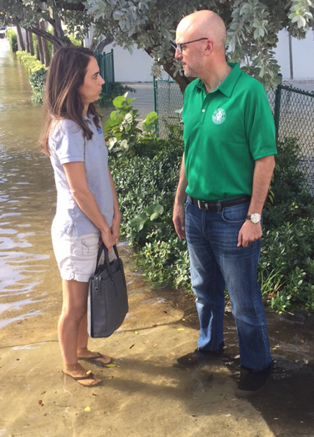 Rep. Ted Deutch speaks with a constituent during king tide flooding in Fort Lauderdale, Fla., on 17 October 2016.