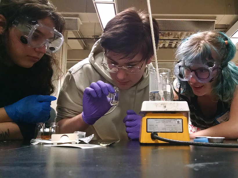 Queer Science participants make polymer chains.