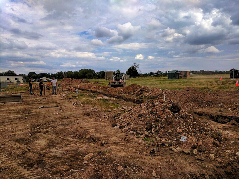 Researchers backfill testbed trenches with natural soil at METEC in Fort Collins, Colo.
