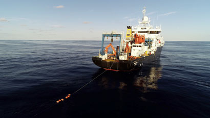 The research vessel towing an observing system mooring
