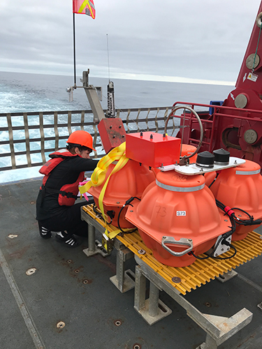 Graduate student Amanda Price inspects a seismometer in preparation for the AACSE deployment off Kodiak. Graduate student Amanda Price inspects a seismometer in preparation for the AACSE deployment off Kodiak.