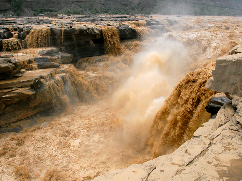 The Yellow River rushes over the Hukou Waterfall in China