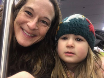 Audrey Taylor, one of the award recipients, with her daughter on her way to AGU’s Fall Meeting 2018
