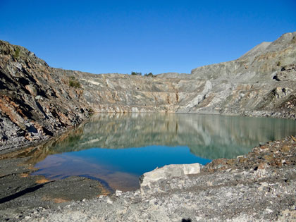 Panoramic view of open pit mine filled with water Panoramic view of open pit mine filled with water