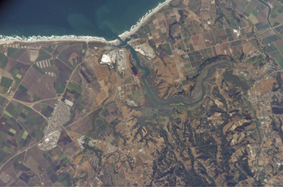 Satellite image of a river emptying into the ocean Satellite image of a river emptying into the ocean