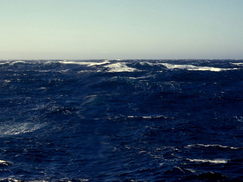 Whitecaps dot a stormy sea