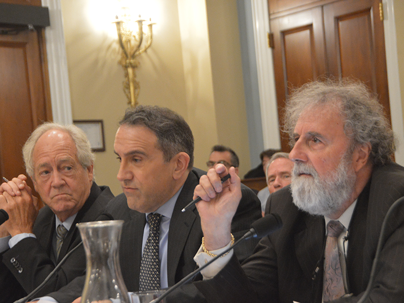 Three white guys in suits give congressional testimony.