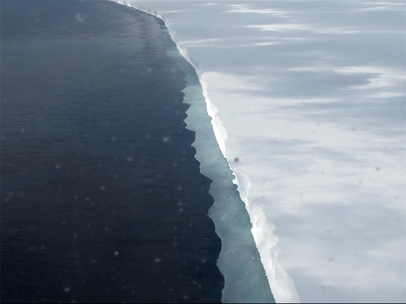 Aerial photo of an ice shelf projecting into the sea