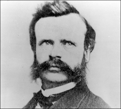 Black-and-white photo of a mustachioed man Black-and-white photo of a mustachioed man
