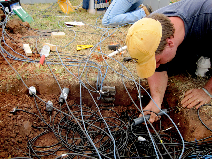 Michael Cosh installs soil moisture sensors near Stillwater, Okla., at the Marena, Oklahoma In Situ Sensor Testbed.