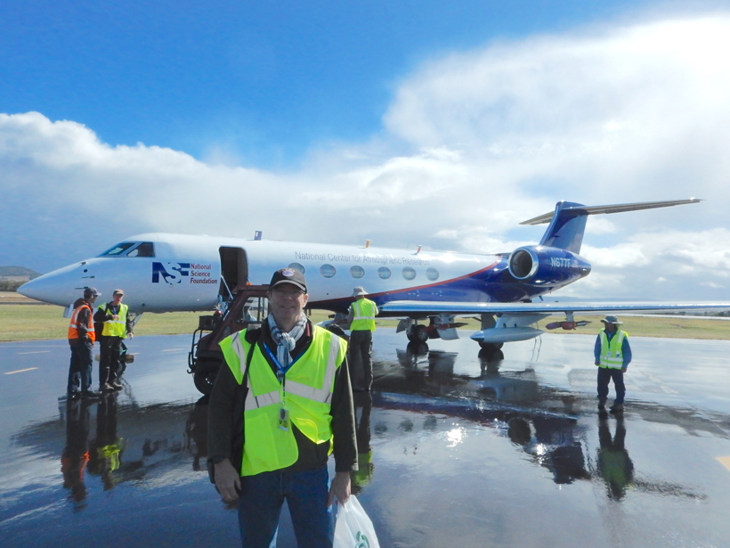 Photograph of a scientist in front of a plane that he used to fly through supercooled liquid clouds