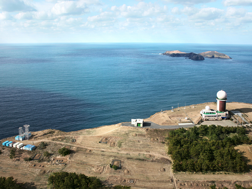 Aerial photo of a scientific facility on the coast
