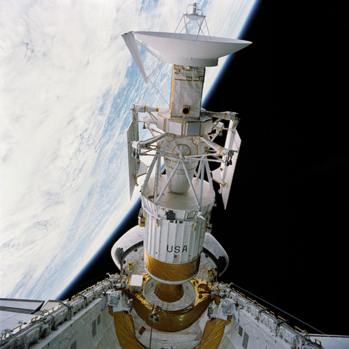 Satellite image of a spacecraft with the horizon of Earth in the background