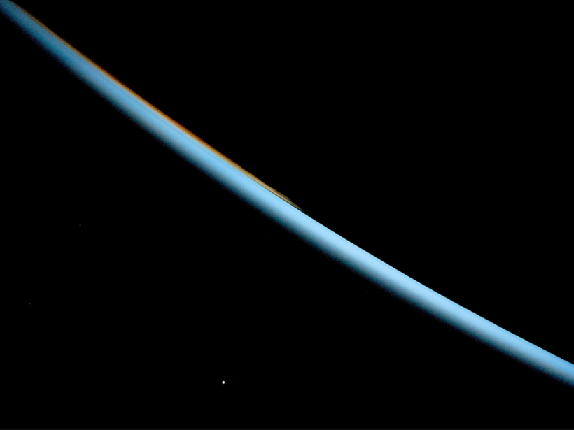 International Space Station photo of Earth’s horizon and Venus