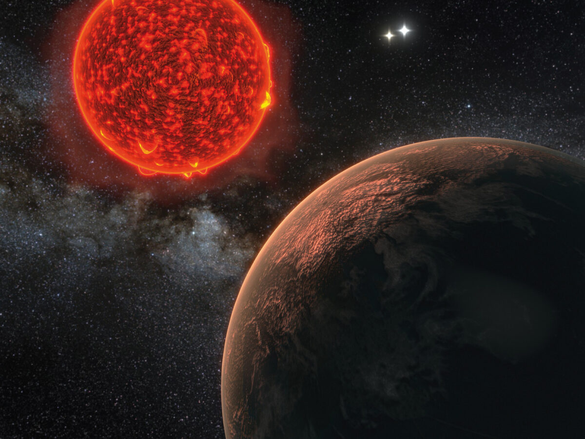 A rocky planet near a red star with two stars in the background