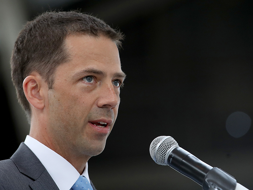 Acting NOAA administrator Neil Jacobs speaks into a microphone.