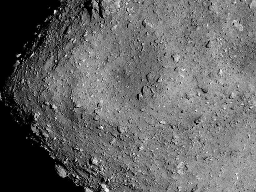 Black-and-white satellite image of the rocky surface of the asteroid Ryugu