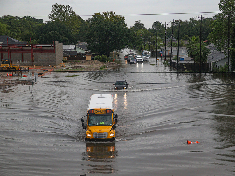 A school bus drives through flooded streets in Houston, Texas, on 19 September 2019.