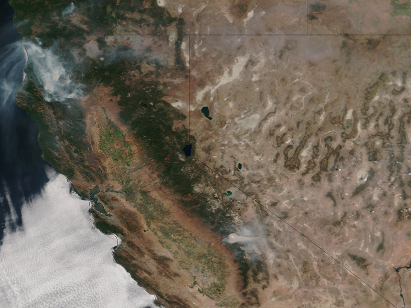 Satellite image of California with wildfire smoke dominating its northwest corner