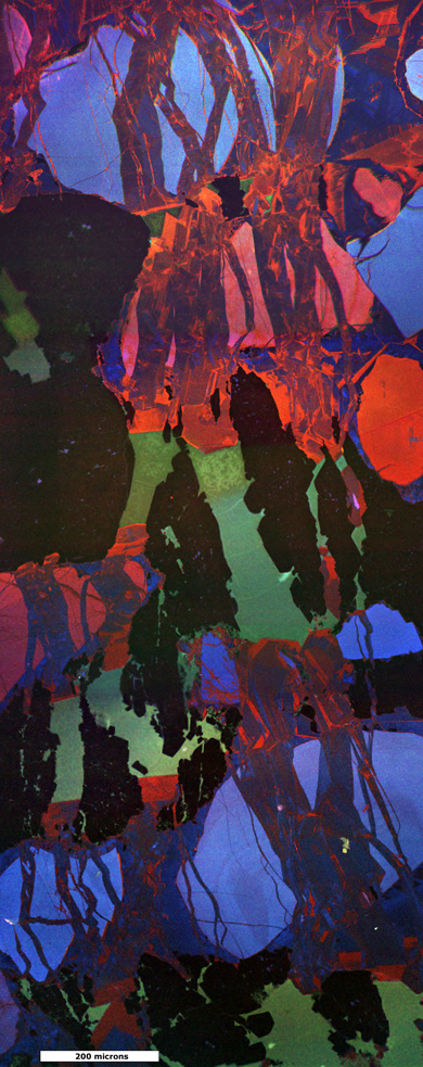 A cathodoluminescence photomicrograph image of chemical features in fractures in Cretaceous sandstone in Wyoming