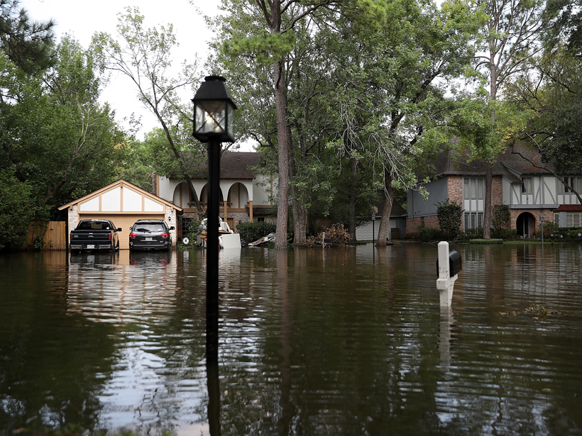 Large houses on a flooded street