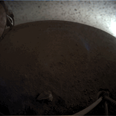 Robotic arm deploying seismometer on Mars