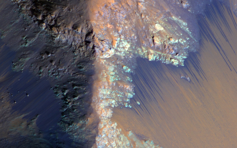 Dark streaks along slope of a crater on Mars