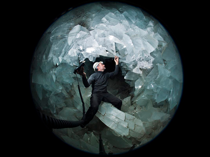 A person stands inside the Pulpí geode.