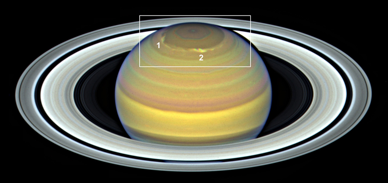Image of Saturn with its north pole squared off and two storms identified