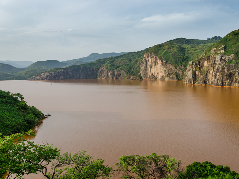 Lake Nyos, Cameroon, surrounded by lush green vegetation