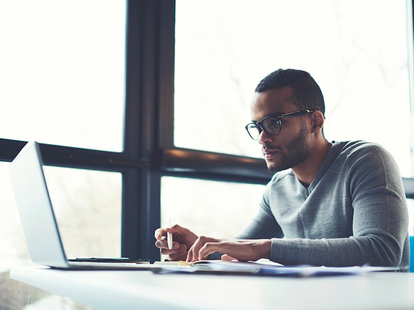 Young man at a laptop