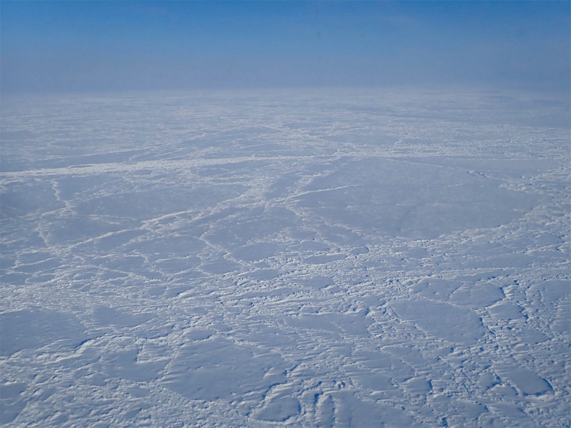 Aerial photo of sea ice extending to the horizon