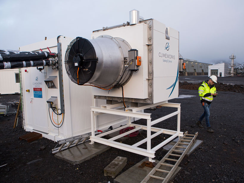 Large industrial fan that physically removes carbon dioxide from the air sits outside a worksite in Iceland.