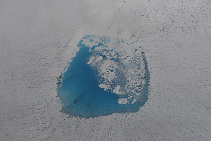 A bird’s-eye view of glacial melt lake atop the Greenland Ice Sheet A bird’s-eye view of glacial melt lake atop the Greenland Ice Sheet