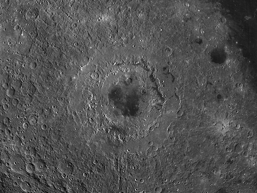 Image of the cratered lunar surface, centered on Mare Orientale, a multiringed crater that resembles a bull’s-eye