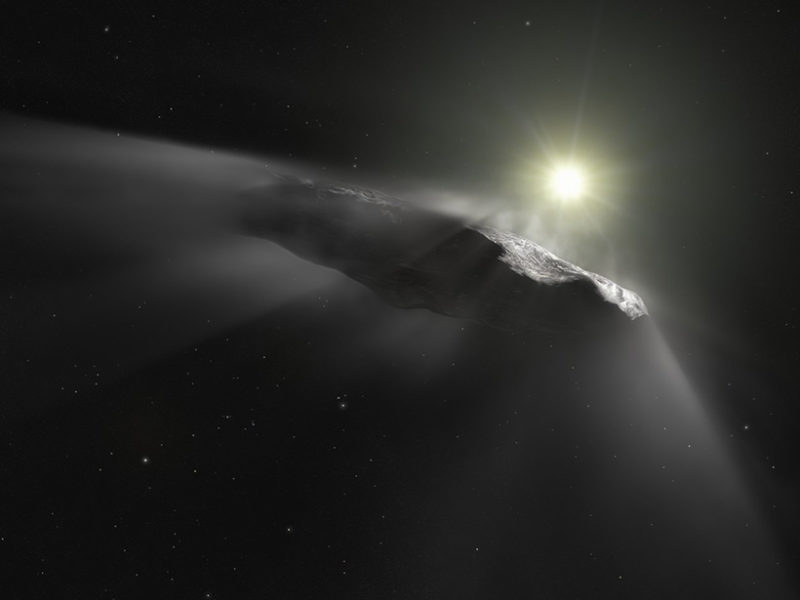 Illustration of the interstellar object ‘Oumuamua shedding dust while hurtling toward the distant Sun