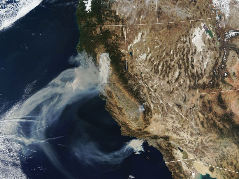 Smoke plumes spread west from the Camp Fire in Northern California and the Hill and Woolsey Fires in Southern California on 9 November 2018, as seen in this image captured by the Moderate Resolution Imaging Spectroradiometer (MODIS) on NASA’s Terra satellite.