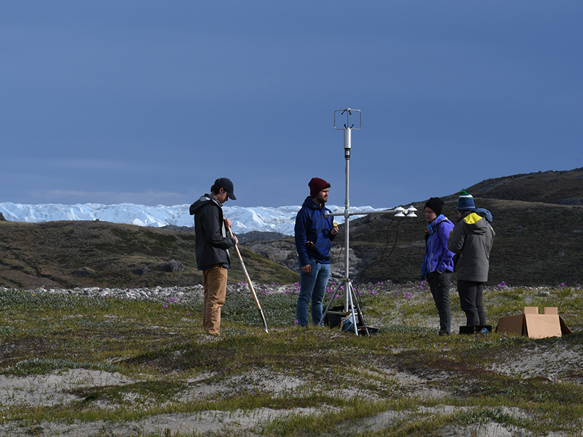 Undergraduate researchers prepare to take radiation measurements during their expedition to the Greenland Ice Sheet last June.