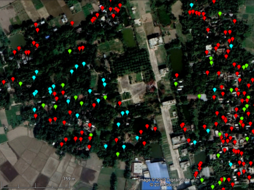 Aerial image of a village in Bangladesh with markers showing arsenic concentrations in wells