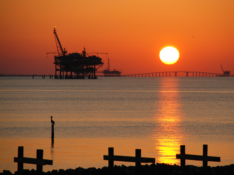 Drilling rig and Dauphin Island Bridge in Mobile Bay, Alabama