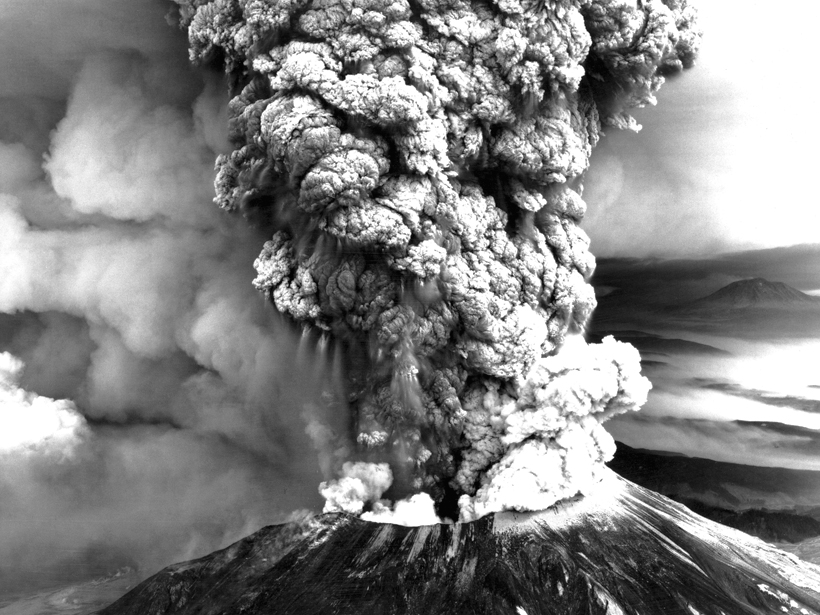 Black-and-white image of Mount St. Helens in 1980 with a billowing ash plume