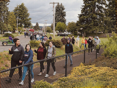 High school students walk along an evacuation route High school students walk along an evacuation route