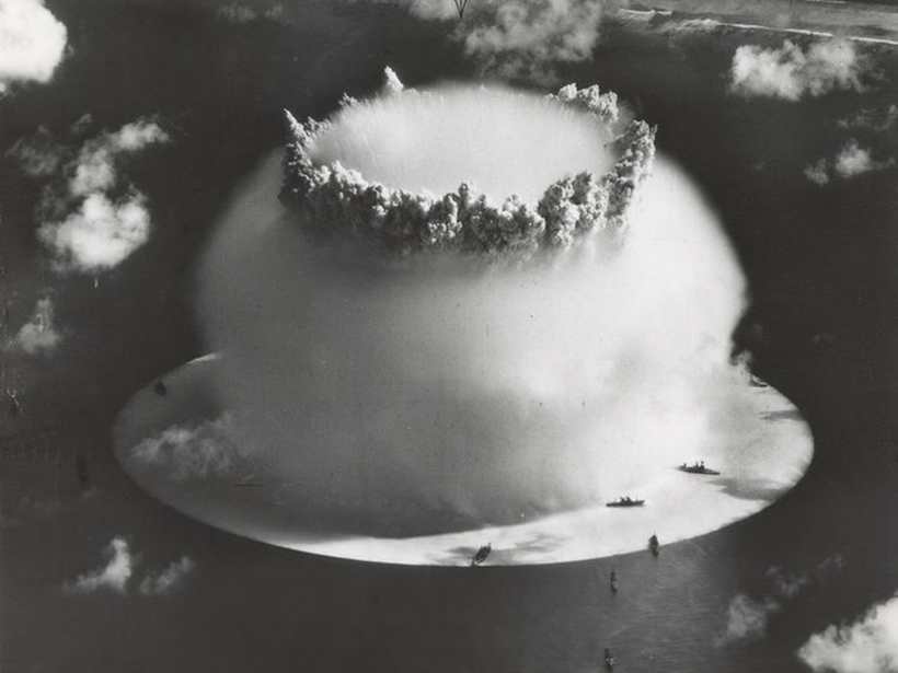 Black-and-white image of a nuclear bomb exploding from underwater