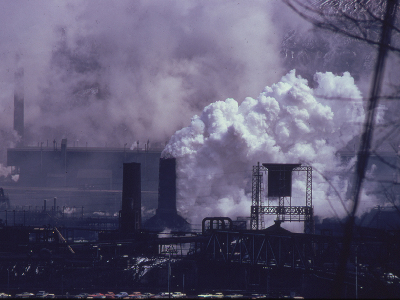 Photo of a coke plant belching white smoke and emissions