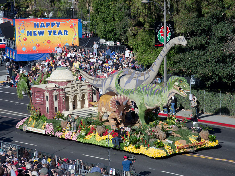 Rose Parade float featuring dinosaurs