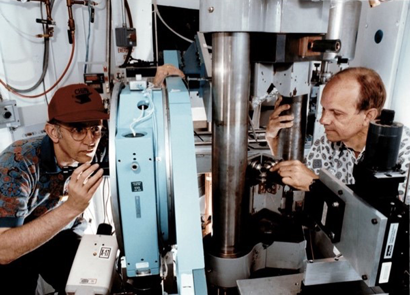 Scientists install an apparatus along a beamline of the National Synchrotron Light Source at Brookhaven National Laboratory.