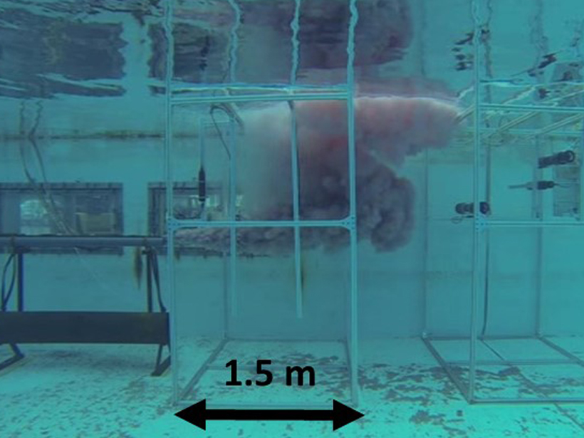 Underwater photograph of a tank experiment designed to observe how diesel oil behaves when leaking from a pipe