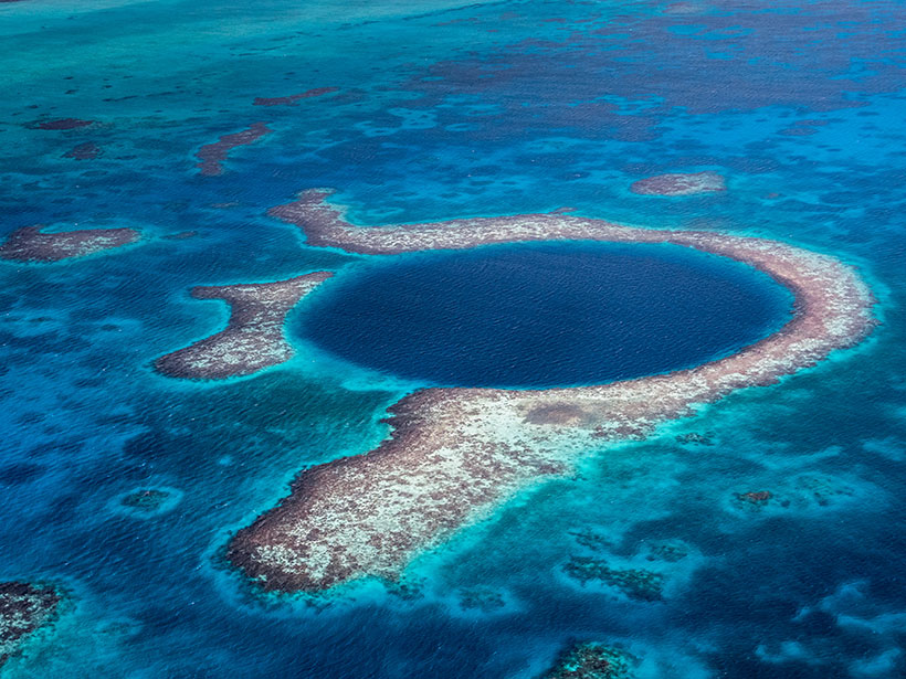 Aerial image of the Great Blue Hole in the Caribbean Sea off the coast of Belize