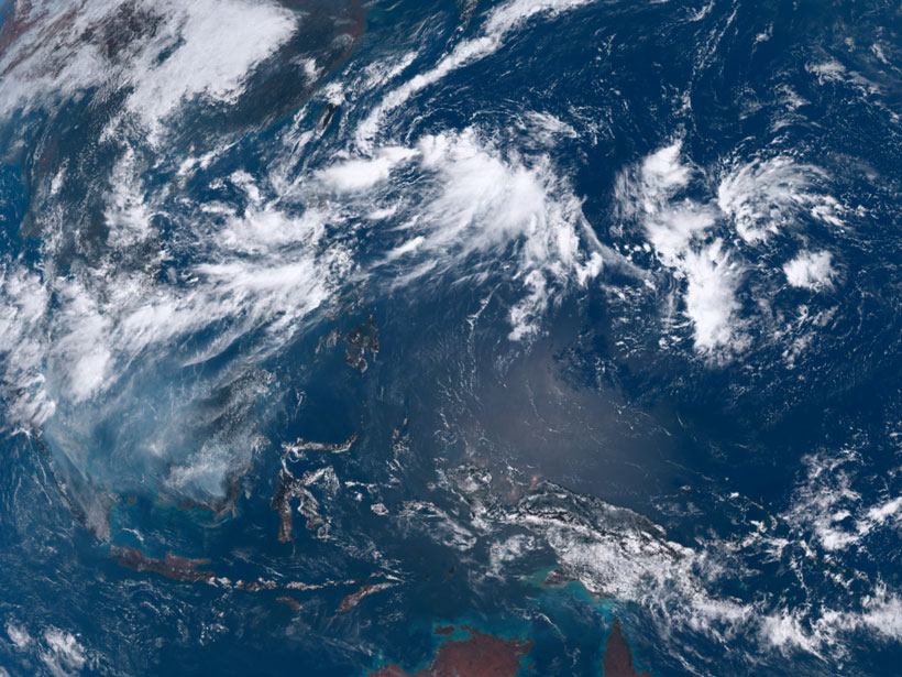 Satellite imagery showing the clouds of convective weather systems over Southeast Asia and the Philippine Sea on 18 September 2019