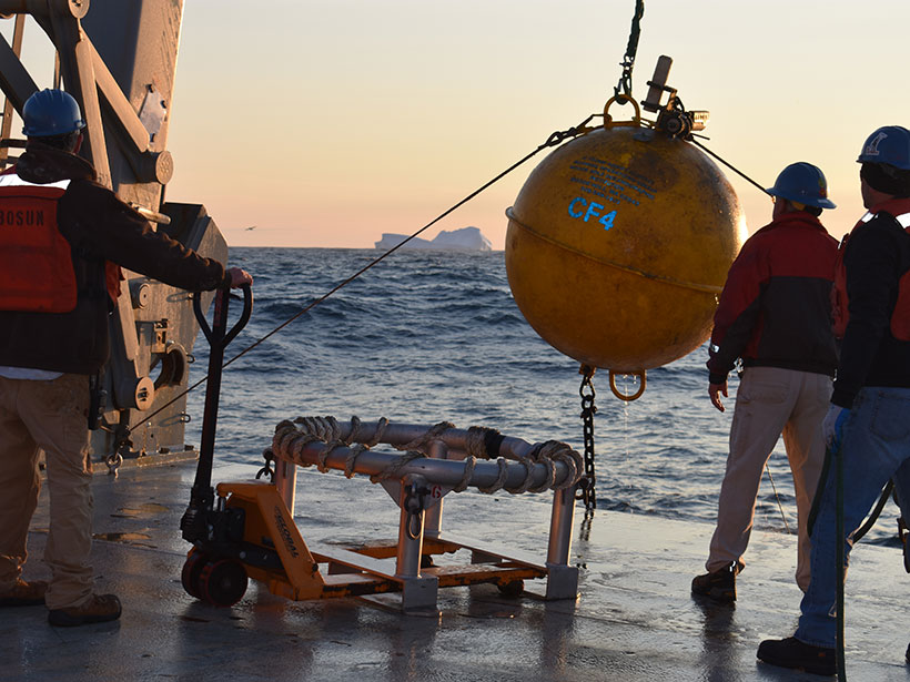 A ship’s crew recovers the flotation sphere for an instrument mooring in the Irminger Sea